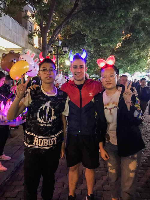 three people with light-up headbands on