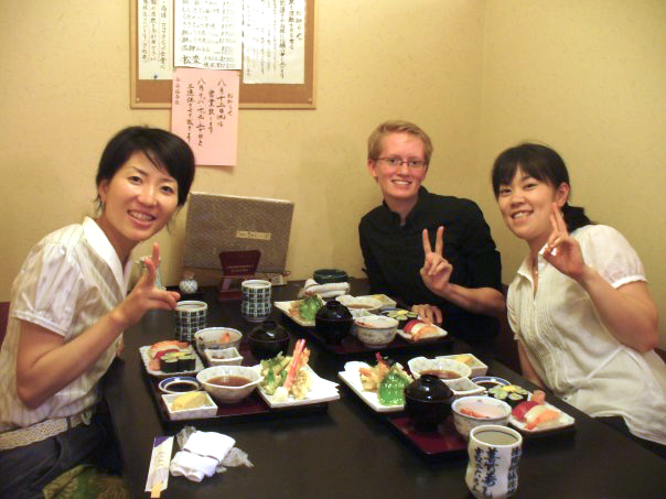 three people eating at a restaurant