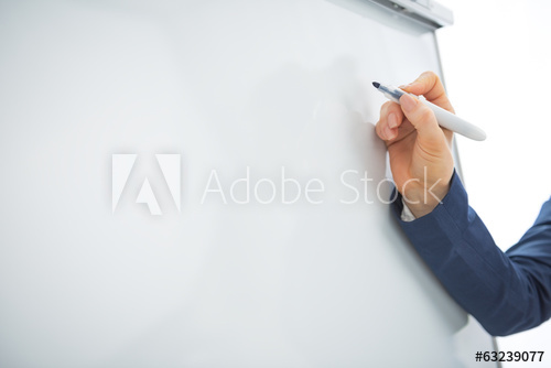 image of hand writing on whiteboard