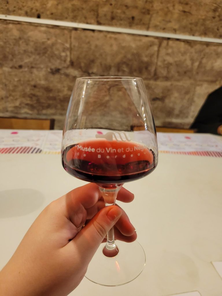 An image of a wine glass with red wine in it. 